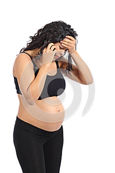 Worried pregnant woman on the phone