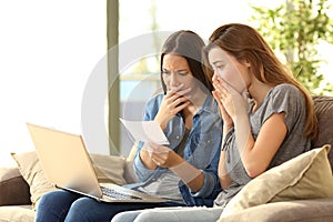 Worried roommates reading a bank notification photo