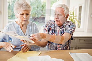 Worried senior couple discussing their bills