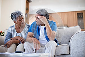 Worried senior couple discussing their bills