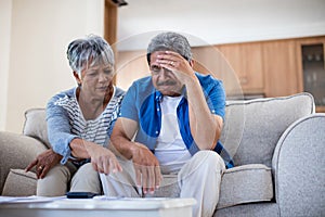 Worried senior couple discussing their bills