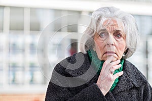 Worried Senior Woman Looking Lost Outdoors