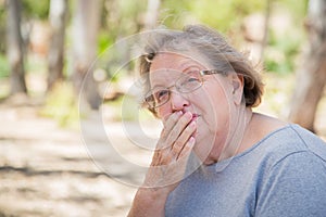 Worried Senior Woman Sitting Alone