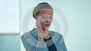 Worried stressed beautiful woman with migraine looking at camera checking tablet sighing. Portrait of overworking tired