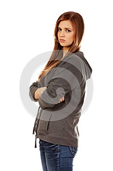 Worried teenage woman with folded arms