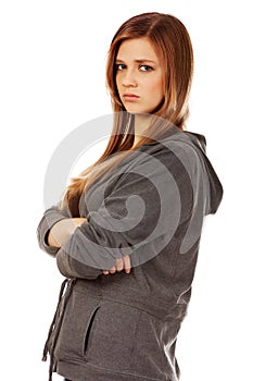 Worried teenage woman with folded arms