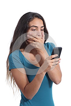 Worried teenager girl looking at smart phone