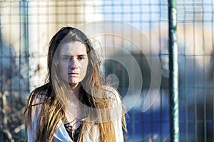 Worried teenager woman outdoors in a sunny day.