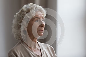 Worried unhappy middle aged woman suffering from loneliness at home.