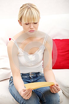 Worried woman's reading letter