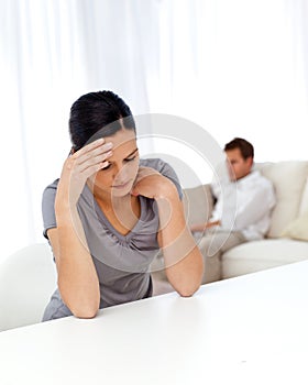 Worried woman sitting at a table