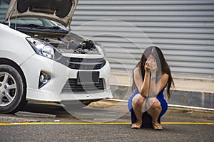 Worried woman in stress stranded on roadside with car engine failure having mechanic problem needing repair service and assistance