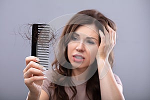 Worried Woman Suffering From Hairloss