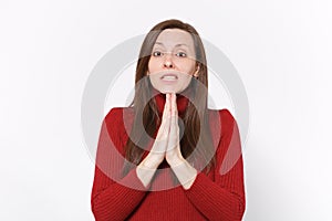 Worried young brunette woman girl in casual red clothes posing isolated on white wall background studio portrait. People