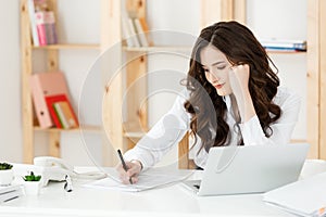 Worried Young Business woman Working With Document At Modern Office