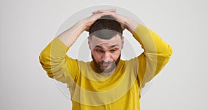 Worried young man in studio