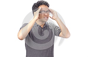 Worried young man suffering from headache