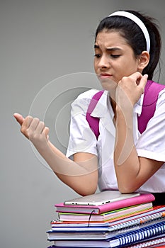 Worrisome Cute Colombian Girl Student Wearing Uniform