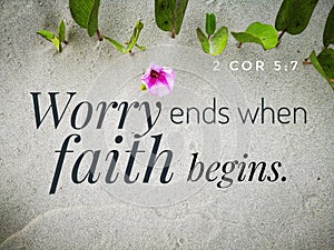 Worry ends when faith begins with bible verse design for Christianity with sandy beach background.