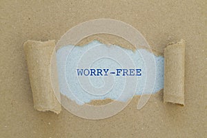 Worry-free written under torn paper.