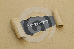 Worry-free written under torn paper.