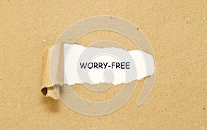 Worry-free written under torn paper.