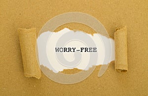 Worry-free written under torn paper.