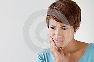 Worry woman with toothache, oral problem