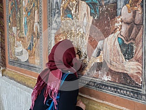 Worshiper at Cheia Monastery, Romania photo