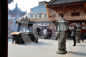 Worshippers at Chinese Taoist temple Shanghai China