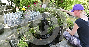 Worshipping at Jizo Statue