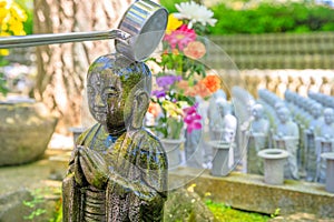 Worshipping at Jizo Statue