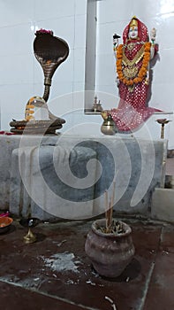 Worshipping the Lord Shiva and Goddess Parvati with the holy smoke sticks in an Indian Hindu Temple