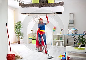 Worth super hero woman in costume use vacuum cleaner