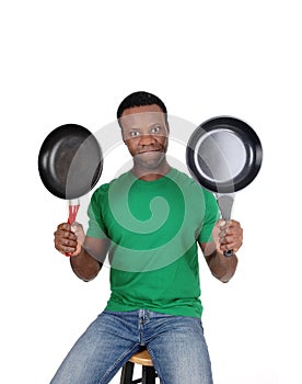 African American man holding up two freeing pan photo