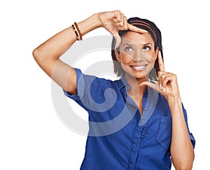 Would you frame this pretty face. A pretty young african american woman framing her face with her hands.