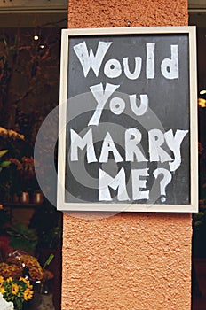 Would you marry me? Marriage proposal on a blackboard