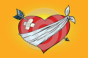 Wounded love red heart with Cupid arrow photo