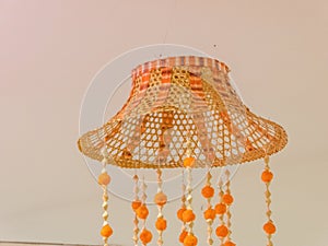 A woven bamboo lamp is a beautifully crafted lighting fixture that adds a touch of natural elegance to any space.