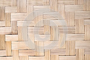 Woven bamboo wood wall texture crafts pattern on brown  background