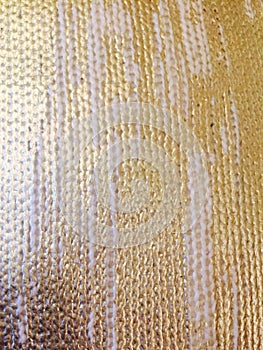 Woven knitted fabric texture with gold paint