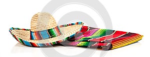 A woven Mexican sombrero or hat with a colorful serape blanket