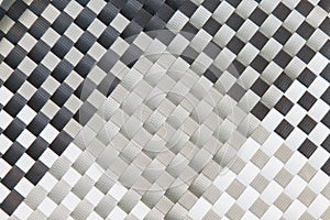 Woven plastic background in black and white