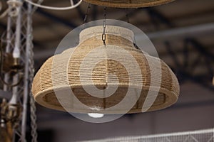 Woven rope chandelier, natural wicker fabric lampshade on the pendant lamp