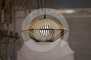 Woven rope chandelier, natural wicker fabric lampshade on the pendant lamp