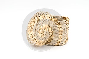 Woven straw basket isolated on white background