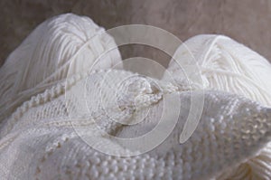 Woven white thread for knitting. White yarn for knitting close-up. knitting patterns