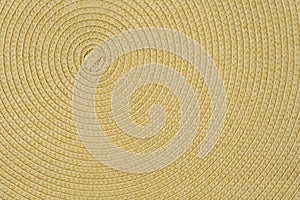 Woven yellow wicker straw background or textur