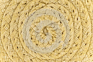 Woven yellow wicker straw background or textur