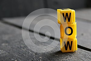 Wow concept, inscription on yellow cubes